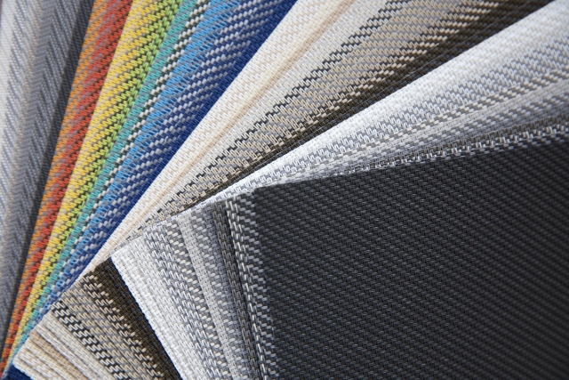 Assortiment zonweringdoeken in verschillende kleuren en patronen